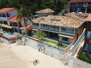an aerial view of a house on the beach at Casa Varandão, 1ª praia, Morro de São Paulo in Cairu