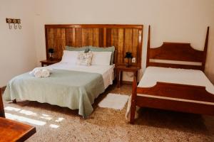 Postel nebo postele na pokoji v ubytování casa de mineiro