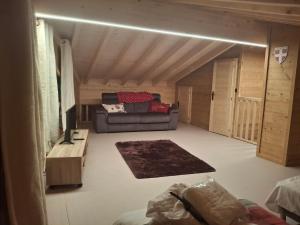 a living room with a couch and a table at Chalet la Fiolaz in Châtel +1 photo