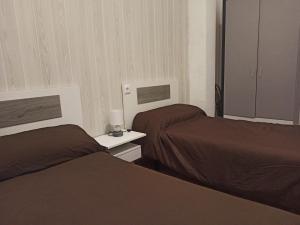 En eller flere senge i et værelse på Vivienda Planta Baja