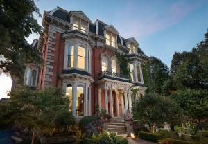 a large red brick house with a lot of windows at The Mansion on Delaware Avenue in Buffalo