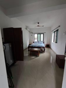 En eller flere senge i et værelse på Carvalhos Regina guest house