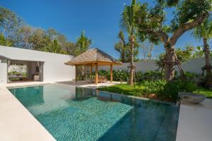 a swimming pool in a villa with a gazebo at Grand garden villa Free Airport Pickup from 7 days in Phuket