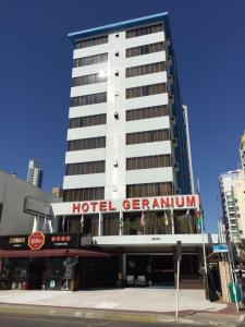 a hotel generico building with a hotel gemulum sign on it at Hotel Geranium in Balneário Camboriú