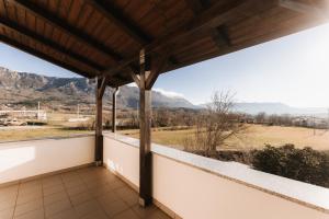 a balcony with a view of the mountains at Apartma Castrum Vini in Ajdovščina