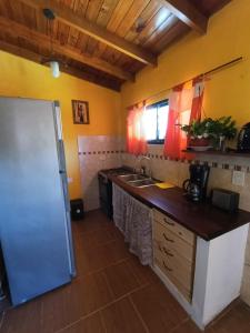 a kitchen with a sink and a counter top at Monoambiente in Mar de Ajó