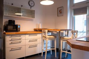 Kuchyň nebo kuchyňský kout v ubytování Luxus Apartment im Goetheviertel mit Badewanne, Regendusche WLAN uvm + 5 fotografií