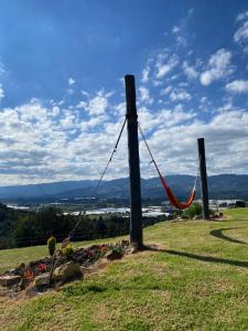 a rope tied to two wooden poles in a field at Finca La Condalia in Nemocón