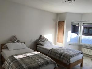 En eller flere senge i et værelse på Villa Cologne - Apartments & Monteursquartiere in Meckenheim bei Köln