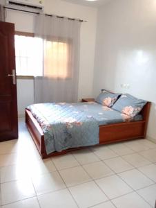 En eller flere senge i et værelse på Villa AV Lomé Proche de l'aéroport + 20 billeder
