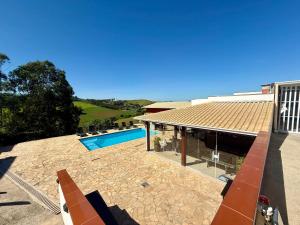 an image of a house with a swimming pool at A Casinha in Socorro