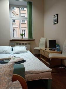 En eller flere senge i et værelse på Noclegi Juliusz Slowacki 6 + 15 billeder