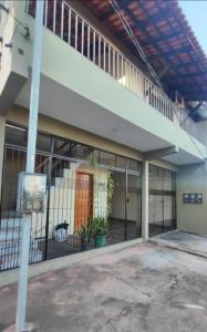 an outside view of a building with a fence at Studio Figueira, Sol in Santarém