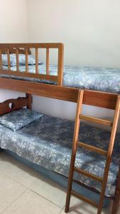 En eller flere senge i et værelse på Casa em Serra Negra