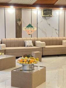 a lobby with a tray of fruit on a table at Moon Desert Luxury Camp in Wadi Rum