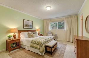 a bedroom with a bed and a desk and a window at Gold rush nook in Grass Valley
