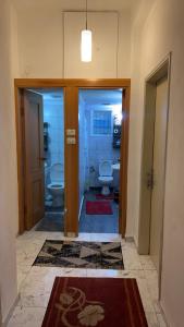 a bathroom with two toilets and two sinks at Handala Guest House in Bethlehem +22 photos