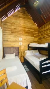 En eller flere senge i et værelse på Arrecife Eco Cabañas Palomino