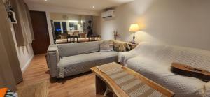 a living room with a couch and a table at Moramay in Punta del Este