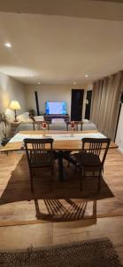 a room with a table and two chairs and a bed at Moramay in Punta del Este