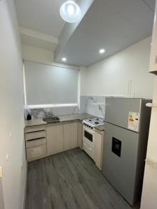 Kuchyň nebo kuchyňský kout v ubytování B&J Apart Bahía