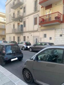 a group of cars parked in a parking lot at AngelHome Matera in Matera