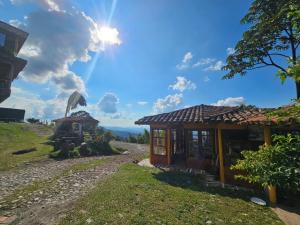 a small house on the side of a hill at Perla del Ruiz in Manizales +16 photos