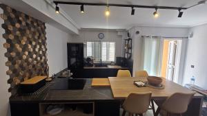 a kitchen with a table and chairs in a room at Casa de ogracia in Rojales