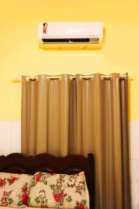 En eller flere senge i et værelse på Casa Ybirá de Alter do Chão