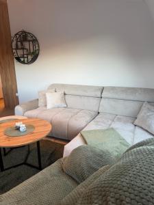 a living room with a couch and a table at Lunara Vlasic in Vlasic