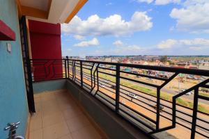 a balcony with a view of a city at Modern 1BR Apartment in Membley & near Ruiru Bypass, Kenyatta University & AMREF, Fast WiFi & Parking-Ruiru Membley in Ruiru