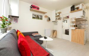 a living room with a couch and a table at Notre-Dame luxury Suite in Saint-germain des prés Latin quarter in Paris