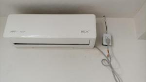 a white printer sitting on a counter with a pair of scissors at Casa alexander 3 in Acapulco