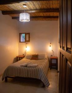 En eller flere senge i et værelse på La Cabañita de Tilcara