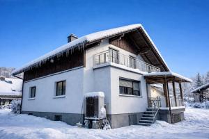 a house in the snow with snow at Apartment Roßleithen in Bahnhof Roßleithen