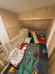a childs room with a bunk bed and a toy train at Chalupa pod jelení skálou in Dolni Dvur +6 photos