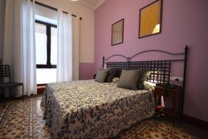 Ein Bett oder Betten in einem Zimmer der Unterkunft Hotel Casa de los Azulejos