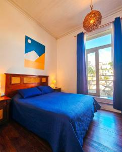 Postel nebo postele na pokoji v ubytování La Galería B&B