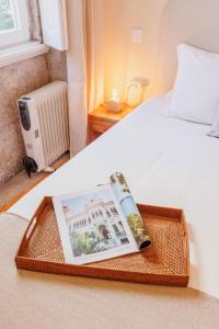 En eller flere senge i et værelse på Cozee Camoes