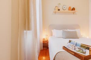 En eller flere senge i et værelse på Cozee Camoes + 22 billeder