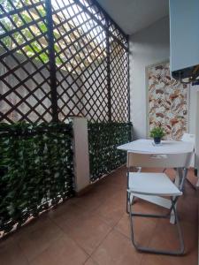 a white table and a chair in a room at Maralbé Guest House in Messina +13 photos