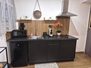 Nhà bếp/bếp nhỏ tại Cosy Corner - Appartement spa - Jacuzzi