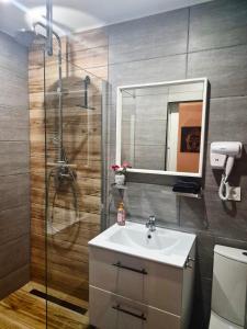 Phòng tắm tại Cosy Corner - Appartement spa - Jacuzzi