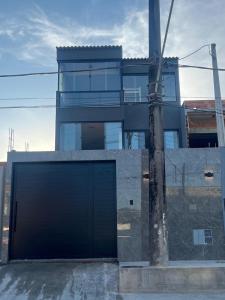 a building with a large door in front of it at Espaço Viva Guarujá in Guarujá