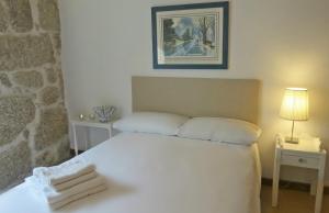 Uma cama ou camas num quarto em Casa do O - Alojamento Local