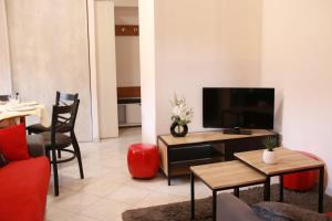 TV a/nebo společenská místnost v ubytování La Loge du Billat