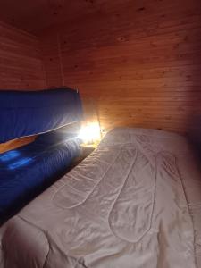 En eller flere senge i et værelse på Cabaña Del Jardín San Pedro De Colalao