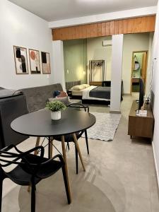 a living room with a table and a couch at Refugio 890 in Tubarão