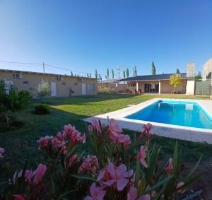 a house with a swimming pool in a yard at Posada Rojo Malbec in San Rafael +36 photos