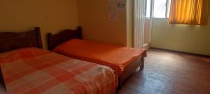 Postel nebo postele na pokoji v ubytování Hotel Villa Vista